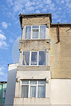 Balcony from old apartment block from communist era in Eastern Europe. Communist socialist architecture style flat.