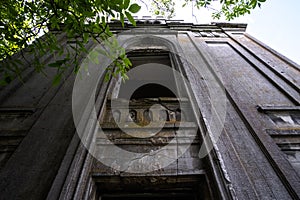 Balcony on the old church's wall with cracks, stone texture