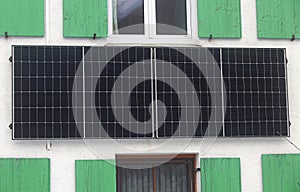 A balcony power plant for generating electricity on a house wall