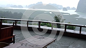 Balcony with sea and many islands viewpoint background on raining day