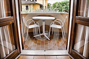 Balcony with table and chairs