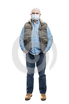 Bald adult man in a medical mask. Full height. Precautions during the coronavirus pandemic. Isolated on a white background