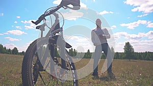 Bald Bicycle Tourist Charismatic Dancing Near Bicycle in the Field on a Beautiful Sunny Day. Cycling is Cool. Free