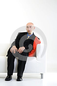 Bald Businessman on Chair