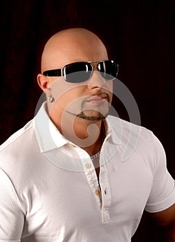 Bald guy wearing fashion sunglasses