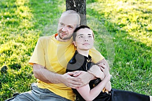 Bald-headed man embraced a girl