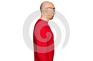 Bald man with beard wearing casual clothes and glasses looking to side, relax profile pose with natural face with confident smile