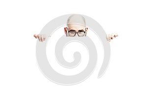 A bald man with glasses peeks out from behind an empty banner. Isolated over white background