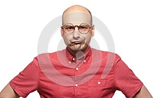 Bald man with sceptical expression of his face