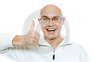 Bald man smiling with thumb up. Isolated on white. Studio