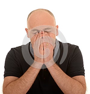 Bald man sneezing