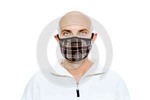 Bald, man in a white jacket and mask. Studio. isolated
