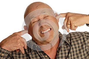 Bald senior man plugging ears photo