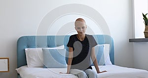 Bald young woman feeling inner strength to fight cancer disease.