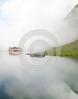 Balea chalet near balea lake on transfagarasan road romania in a foggy day