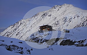 Balea Lake Chalet on sunset in the Fagaras Mountains