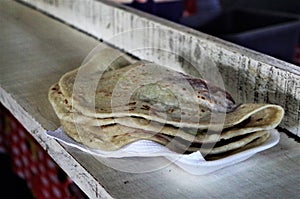 Baleadas on a market stuffed with beans and cream