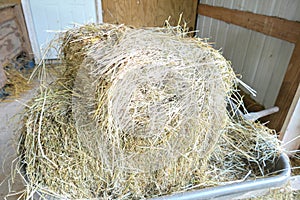 Bales of hay stacked in a barn