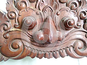 Bali carving of a giant bulging head