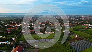 Bali flying above the Canggu City towards the Volcano in the evening