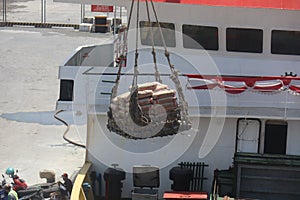 Bali, Oct 2022. stevedore rigger foreman and the ship's crew are assisting the process of loading an unlaoding at port