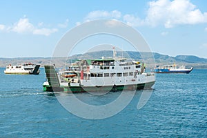 Bali public ferry ship carrying passengers from Gilimanuk harbour in Bali Island to Ketapang harbour East Java, Indonesia.