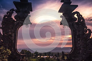 Bali Pura Besakih temple gates from high viewpoint on horizon during sunset as Bali travel lifestyle