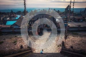 Bali Pura Besakih temple panorama high viewpoint from temple stairs scenery on horizon during sunset as Bali travelling lifestyle