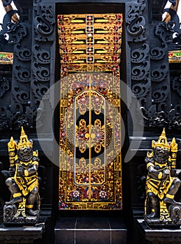 Bali temple entrance with guardians