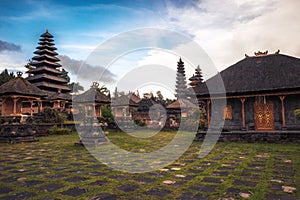 Bali temple Pura Besakih with towers on mount Agung hillside during sunset as Bali travel lifestyle