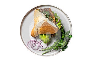 Balik Ekmek Turkish fish sandwich with grilled mackerel fillet in a bun. Isolated on white background.