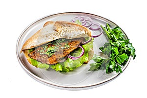 Balik Ekmek Turkish fish sandwich with grilled mackerel fillet in a bun. Isolated on white background. Top view.