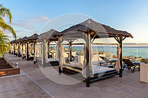 Balinese beds on a terrace with ocean view