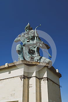 Balinese hindu statue over the blue sky