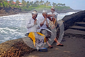 Balinese men by the sea photo