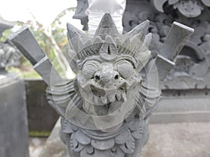Balinese Pura's carving stone statue photo