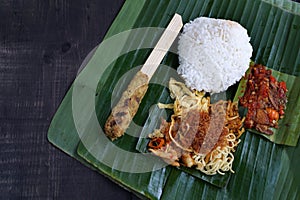 Balinese ready-to-eat street food, packaged in small portions of banana leaves