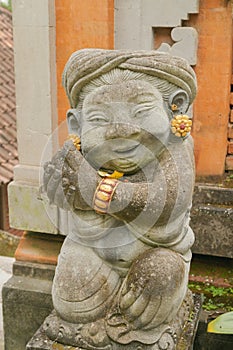 balinese stone statue in the garden