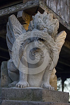 Balinese grey stone statue. Kintamani Highland temple photo