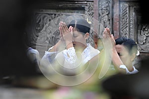 Balinese women in prayer