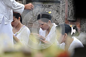 Balinese women in prayer