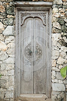 Balinese wood carved doors with traditional local ornaments