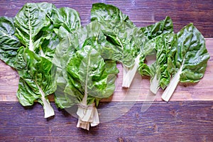 Balkan cuisine. Blitva  chard leaves  - popular leafy vegetables on rustic background