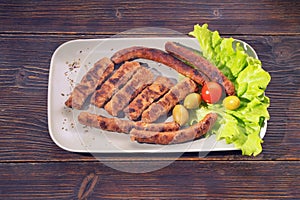 Balkan cuisine. Cevapi, grilled dish of minced meat. Copy space