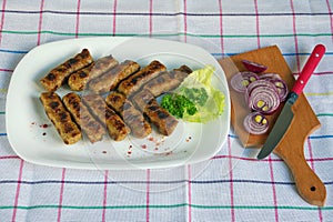 Balkan cuisine. Cevapi - grilled dish of minced meat