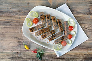 Balkan cuisine. Cevapi - grilled dish of minced meat. Flat lay, free space for text