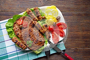 Balkan cuisine. Pljeskavica and cevapi - grilled dish of minced meat. Flat lay, copy space