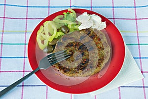 Balkan cuisine. Pljeskavica - a grilled dish of meat photo