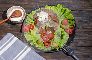 Balkan cuisine. Pljeskavica, kajmak and fresh vegetables photo
