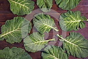 Balkan cuisine. Rastan  Collard greens, collards  - popular leafy vegetables.  Dark rustic background, flat lay